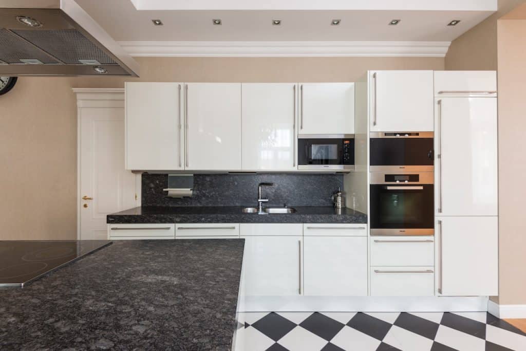Modern kitchen with white cabinets and appliances