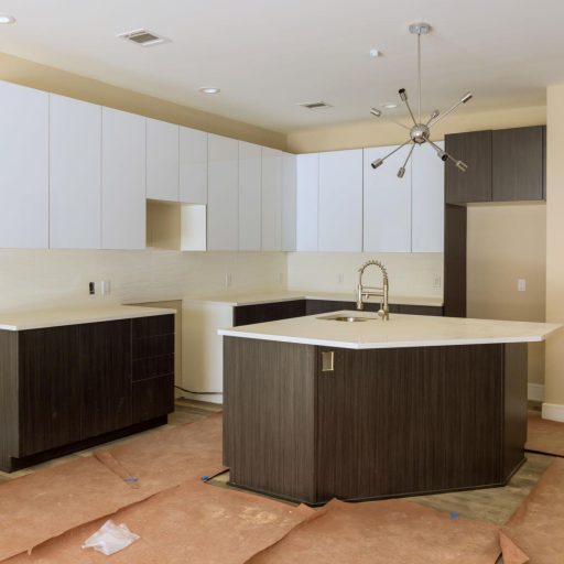 Modern kitchen with island under construction.