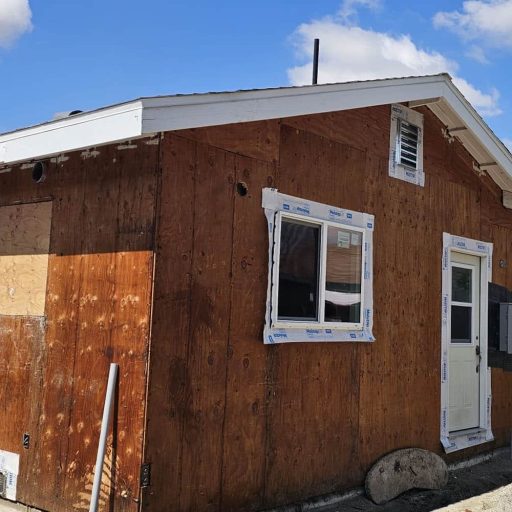 Small house under renovation with plywood exterior