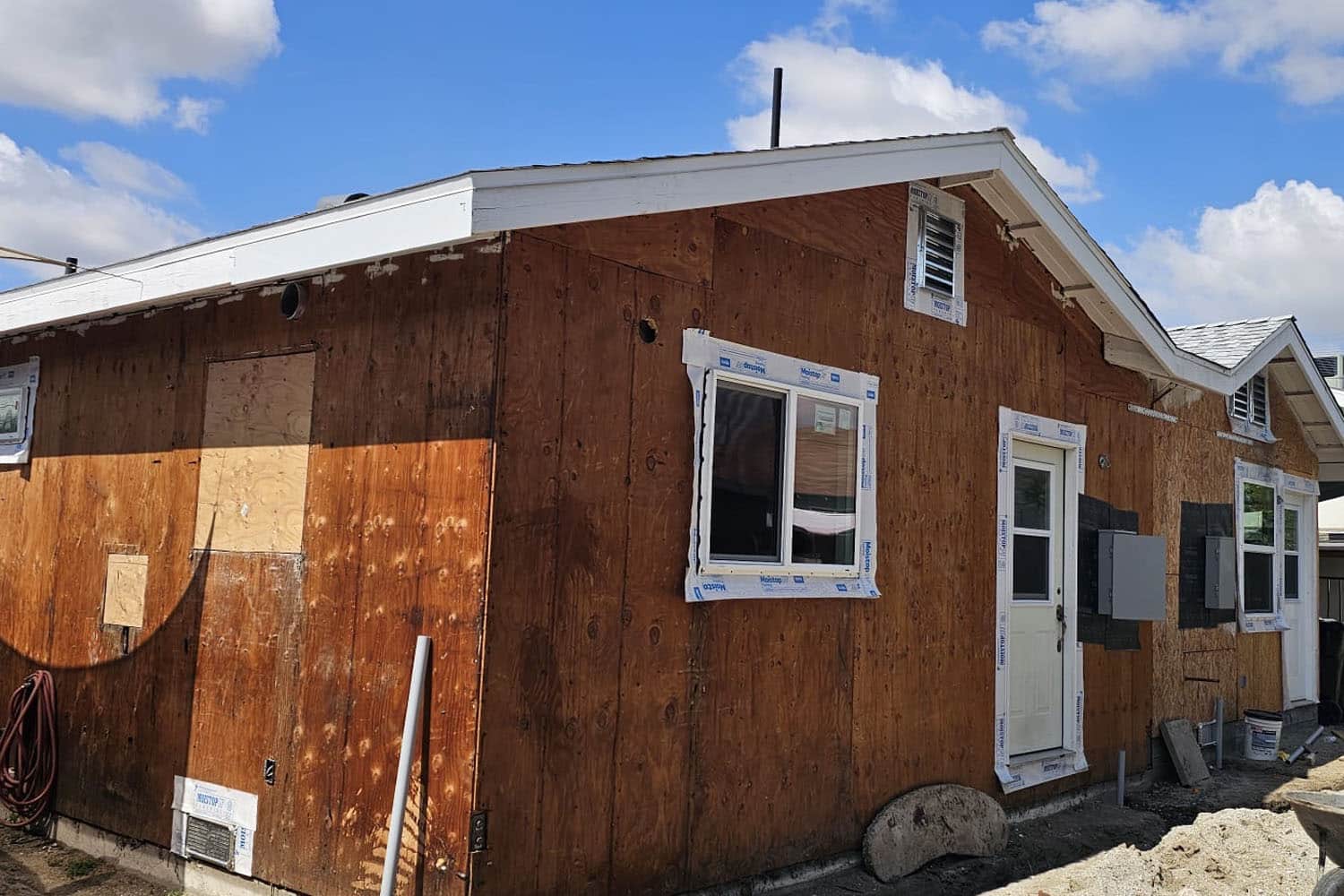 Small house under renovation with plywood exterior