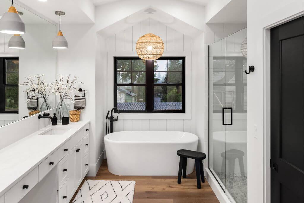 Modern white bathroom with freestanding tub and shower