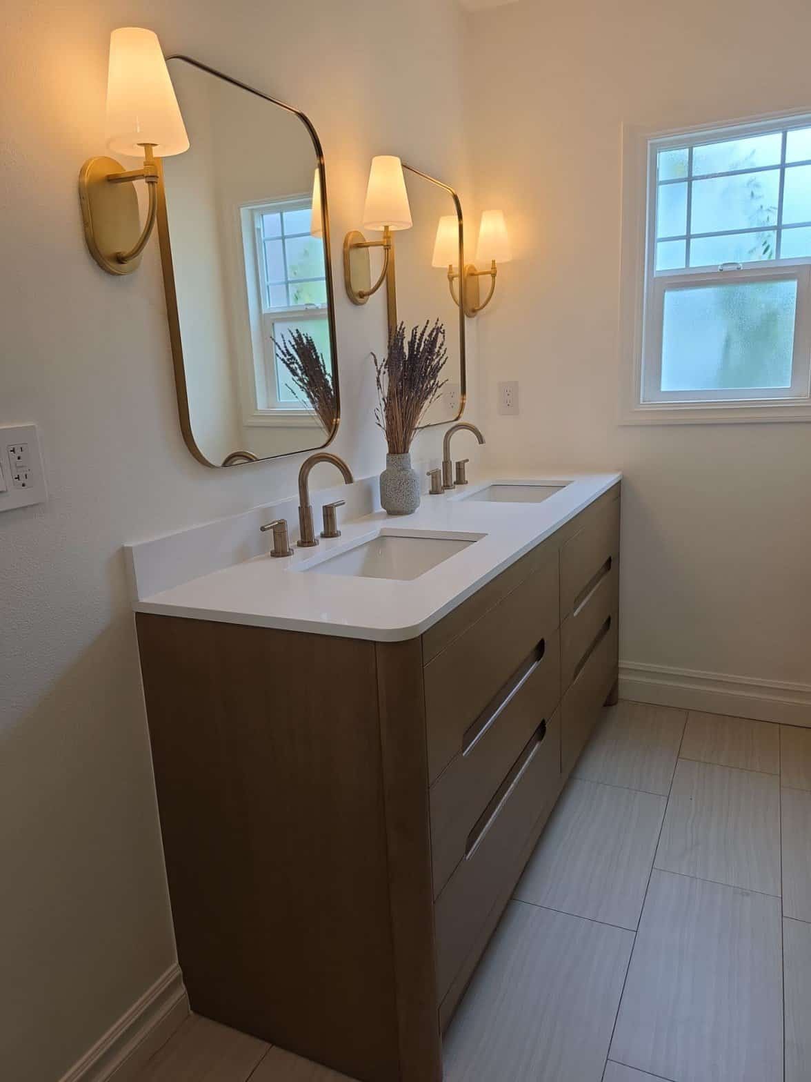 Bathroom remodel with double vanity and framed mirrors in Los Angeles