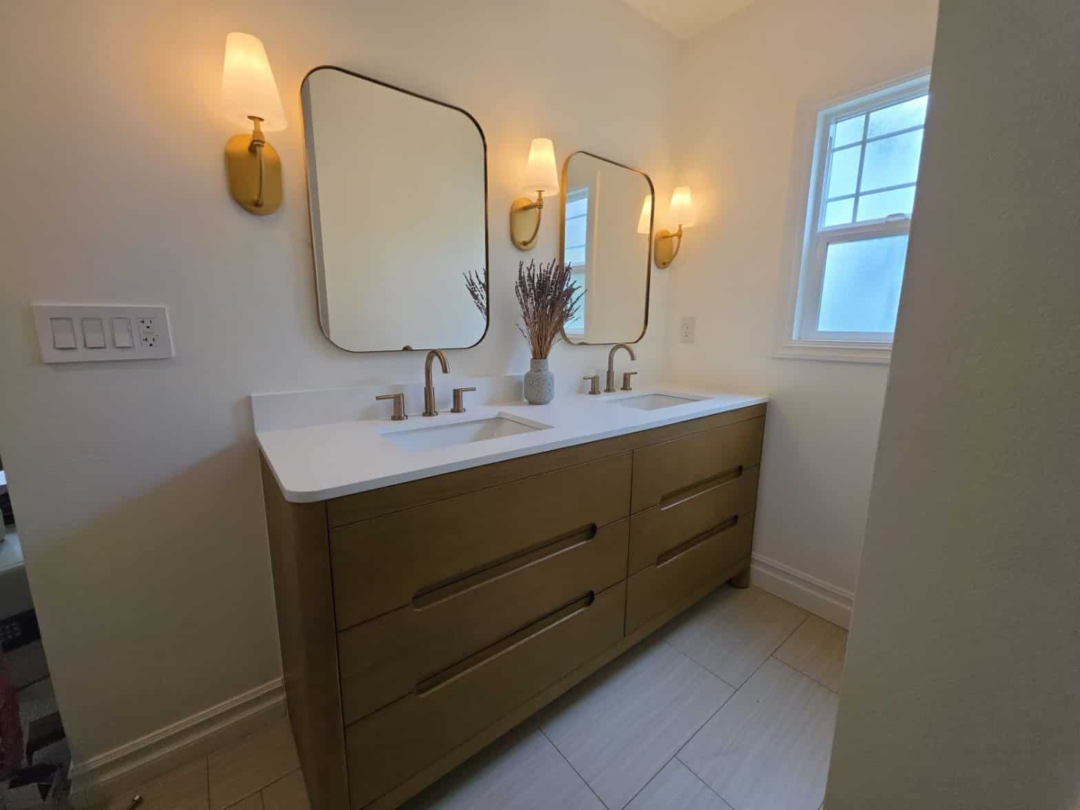 Bathroom remodel with wood vanity and tiled shower Bathroom remodel with wood vanity and tiled shower in Los Angeles