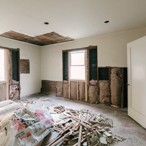 Interior gut demolition exposing ceiling beams during a full home renovation in Los Angeles