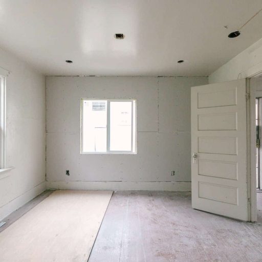 Bright freshly renovated interior room with new drywall and finish work in Los Angeles