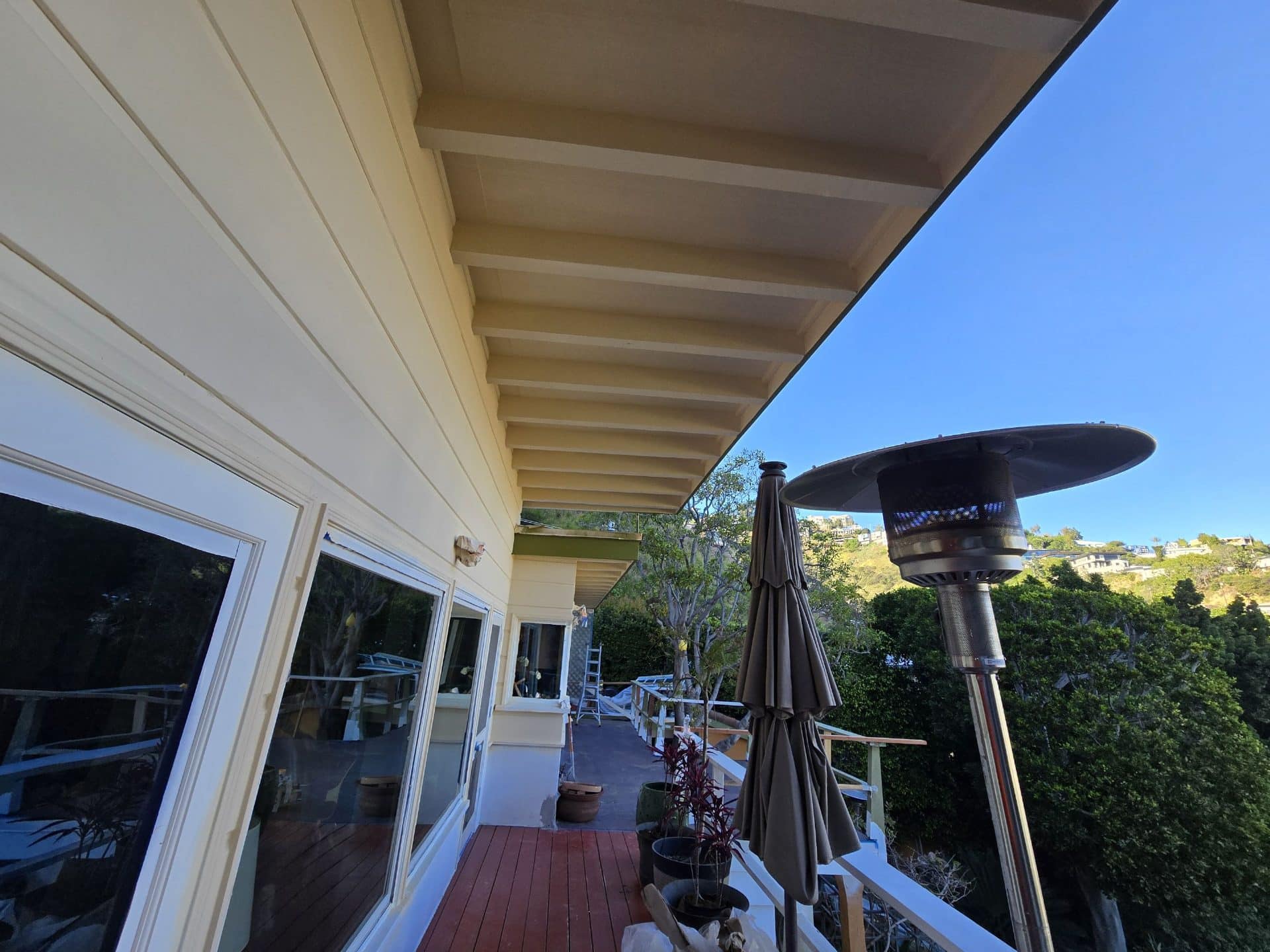 Painted deck soffit, wood decking, patio heater, closed umbrella | Hollywood Contractor Corp Painted deck soffit, wood decking, patio heater, closed umbrella — Hollywood Contractor Corp