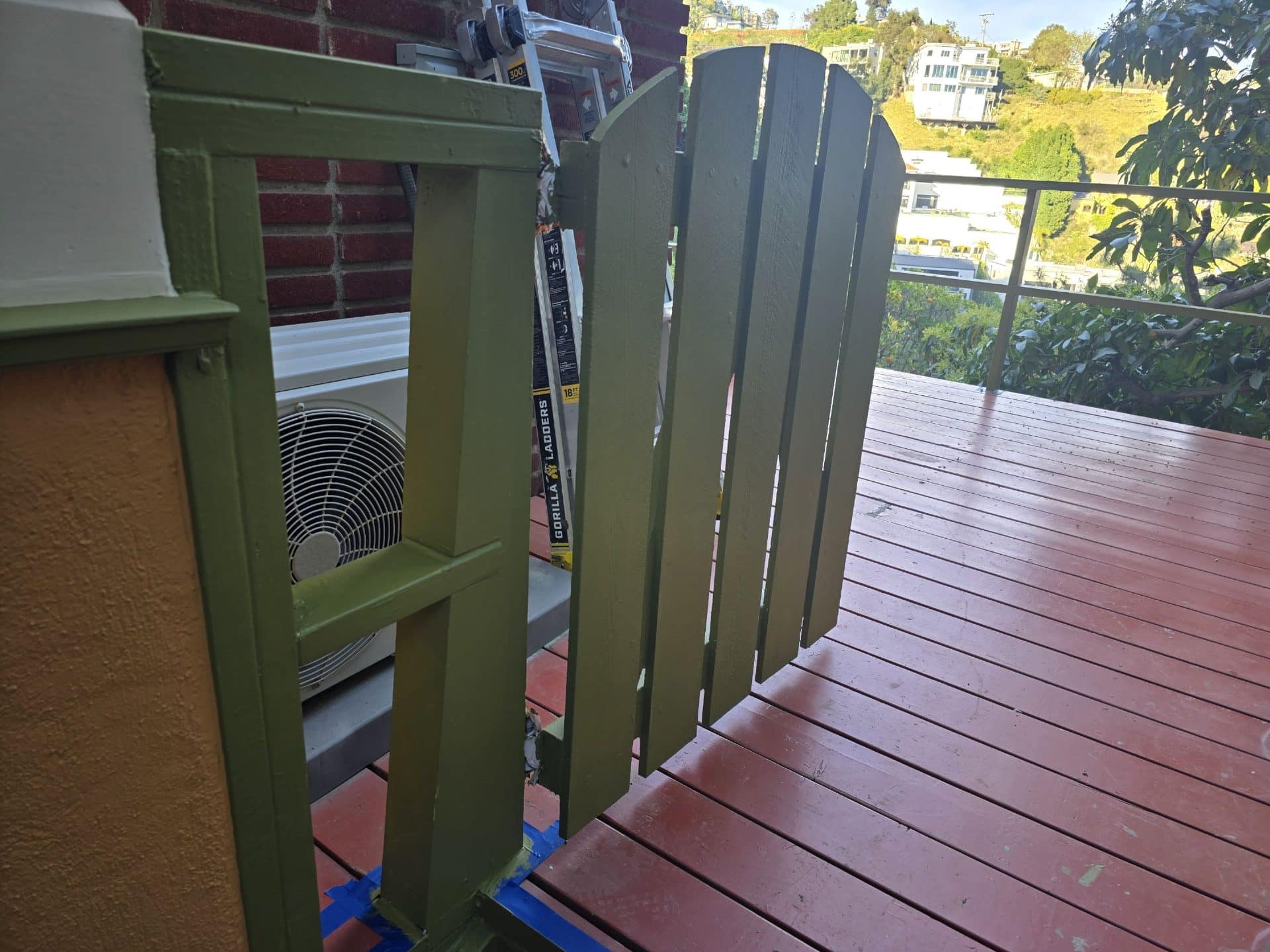 Olive-green painted wood gate and post on redwood deck — Hollywood Contractor Corp